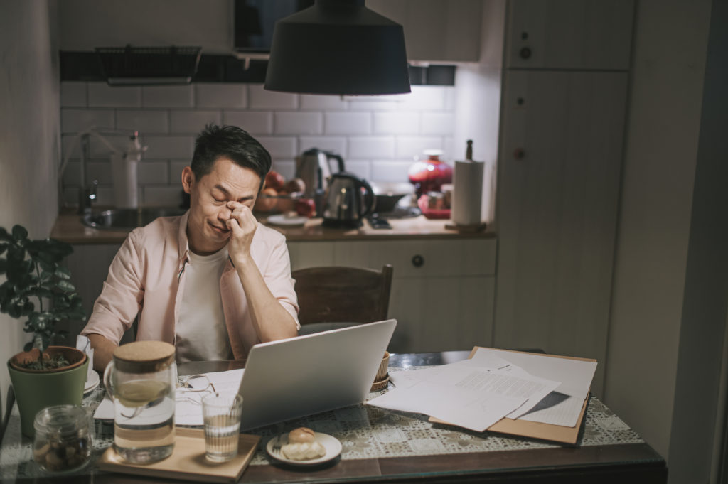 Man up late worrying over work.