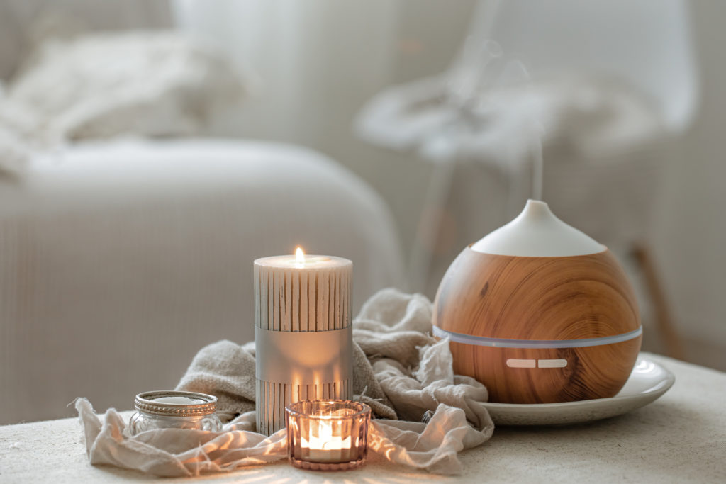 An aroma diffuser for moisturizing the air and scented candles.