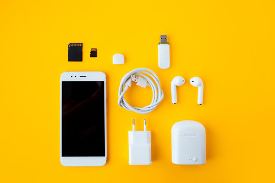 Various phone accessories next to an iPhone