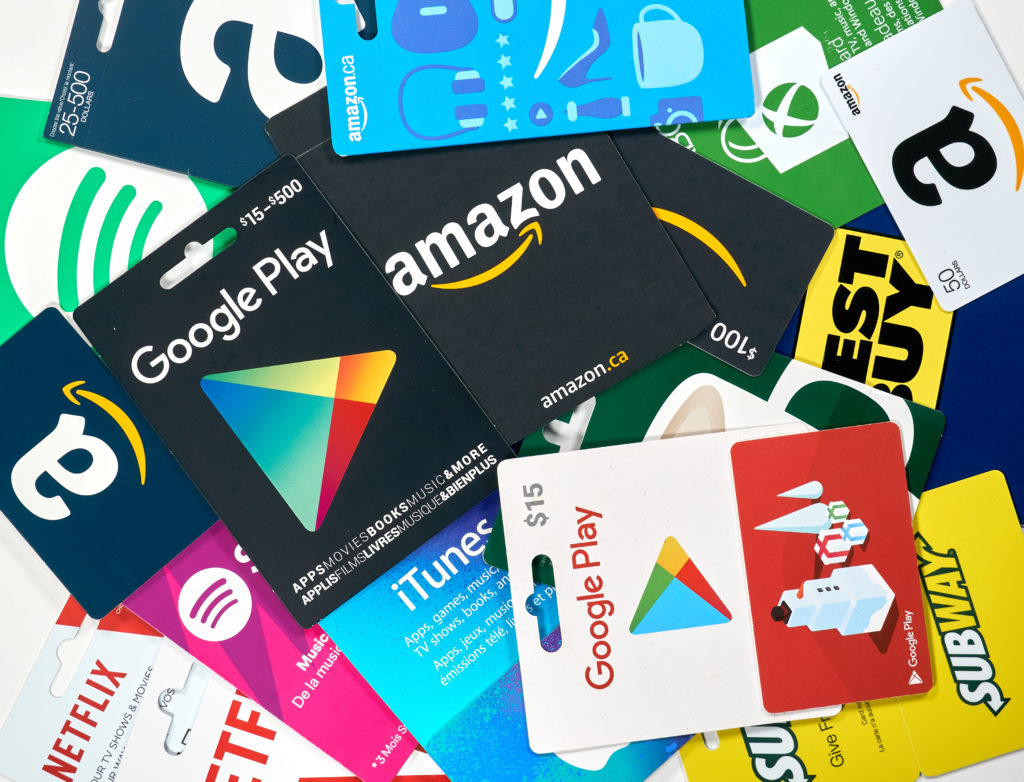 Different gift cards of many brands such as Amazon, Netflix, Xbox, Google Play, Best Buy, Spotify. 