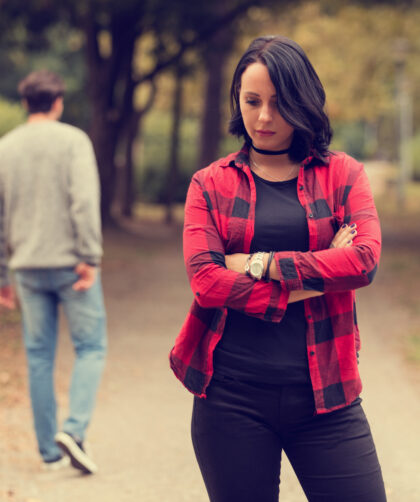 Man walking away from woman after a break up.