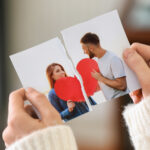 Woman tearing up photo of happy couple