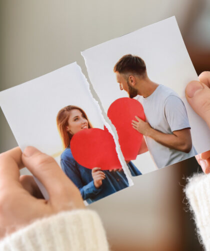 Woman tearing up photo of happy couple