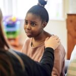 psychologist woman and support, talking or counseling help for problem, mental health or therapy consultation. Listening, empathy and therapist person, african teen for school or life advice