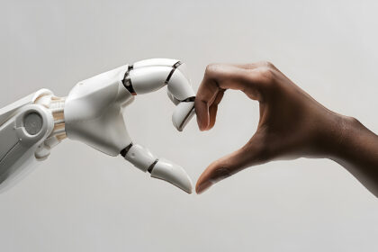 A white ai robot hand and a black human hand come together to form the shape of a heart. Heart shaped by human and ai robot hands. Isolated on light grey background.
